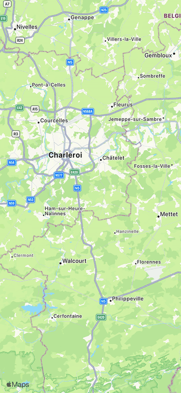 One cluster over Brussels: zoom in and its pins dispatch over the area, zoom out and they pack back into one